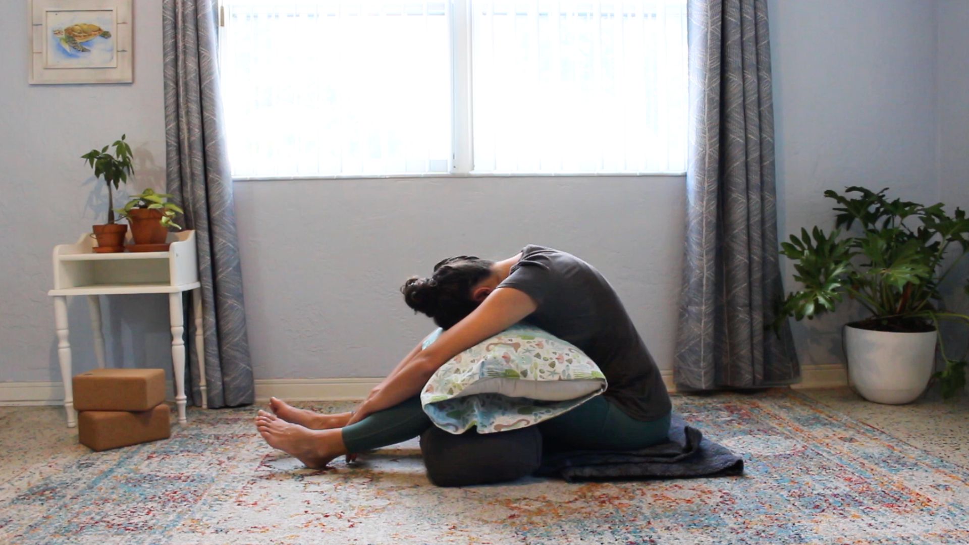 christian yoga for grief forward fold with props for support